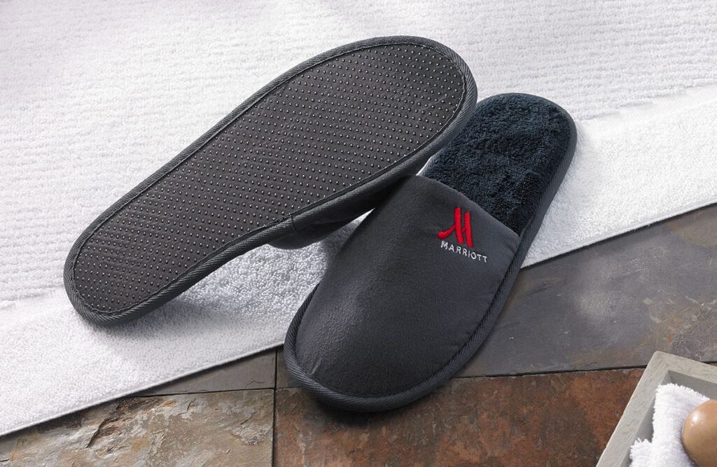 Luxurious black Marriott hotel slippers with anti-slip soles, offering comfort and style for premium guests
