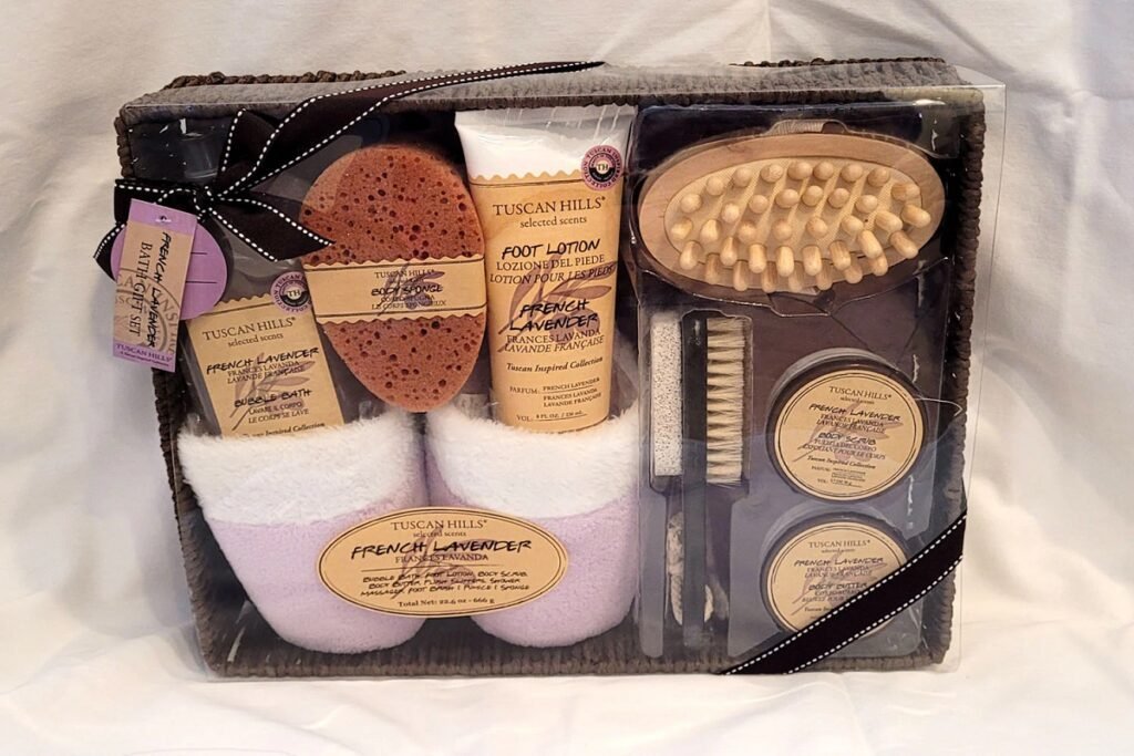 Luxury spa gift set featuring lavender-scented lotions, foot care tools, and cozy slippers, all elegantly packed in a basket with ribbon accents